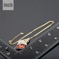 Pendant detail on KHAISTA red paved crystal pendant necklace