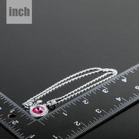 Pendant detail on KHAISTA red round crystal pendant necklace
