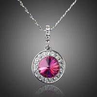 KHAISTA red round crystal pendant necklace on white background