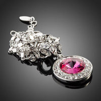 Side angle view of KHAISTA red round crystal pendant necklace