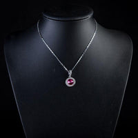 Close up detail of KHAISTA red round crystal pendant necklace