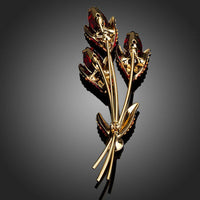 Close-up of red crystals on Khaista scion brooch