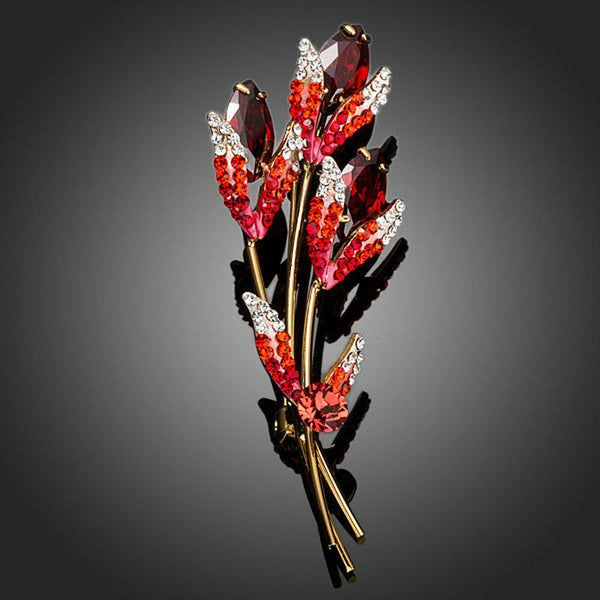 Khaista red crystal scion branch brooch on white background