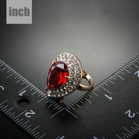 Side angle view of Khaista red cubic zirconia teardrop ring