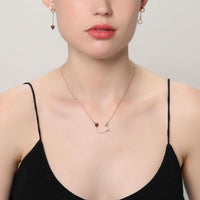 Side angle view of Khaista red zirconia heart set
