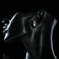 Side angle view of KHAISTA rhinestone crystal stud earrings
