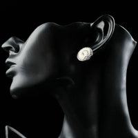 Close up of KHAISTA rhinestone flower stud earrings