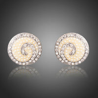 KHAISTA rhinestone flower stud earrings on white background