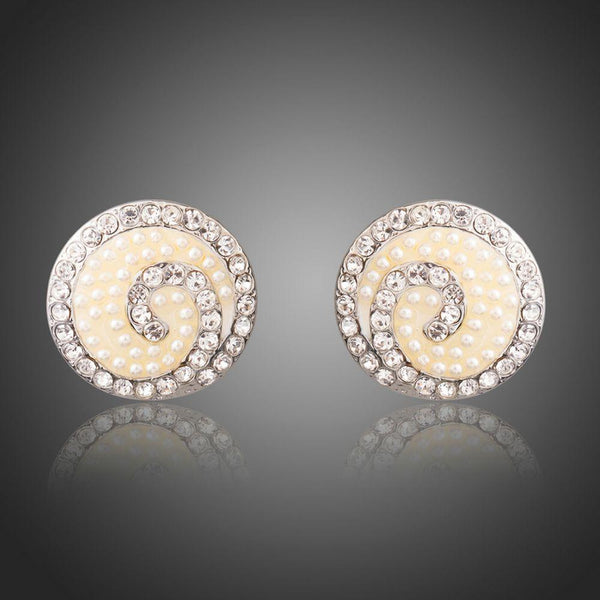 KHAISTA rhinestone flower stud earrings on white background