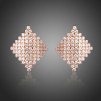KHAISTA rhombic crystal stud earrings on white background