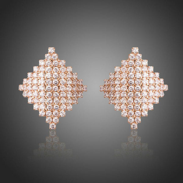 KHAISTA rhombic crystal stud earrings on white background