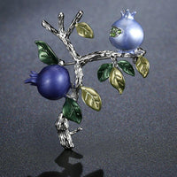 Tree design detail on Khaista oil paint brooch