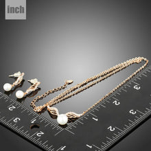 Load image into Gallery viewer, Rose Gold Angel Wings and Simulated Pearl Necklace and Earrings Set - KHAISTA Fashion Jewellery

