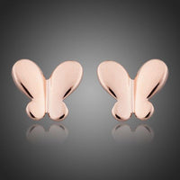 KHAISTA rose gold butterfly earrings on white background