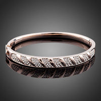 KHAISTA rose gold classic bangle on white background