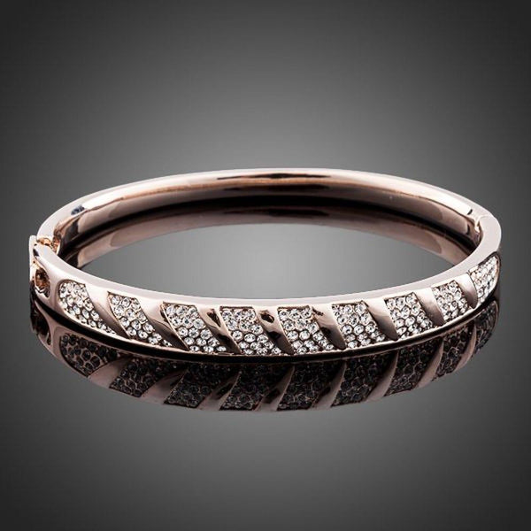 KHAISTA rose gold classic bangle on white background
