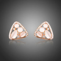KHAISTA rose gold crystal clip earrings on white background