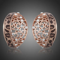 KHAISTA rose gold Stellux Austrian stud earrings on white background
