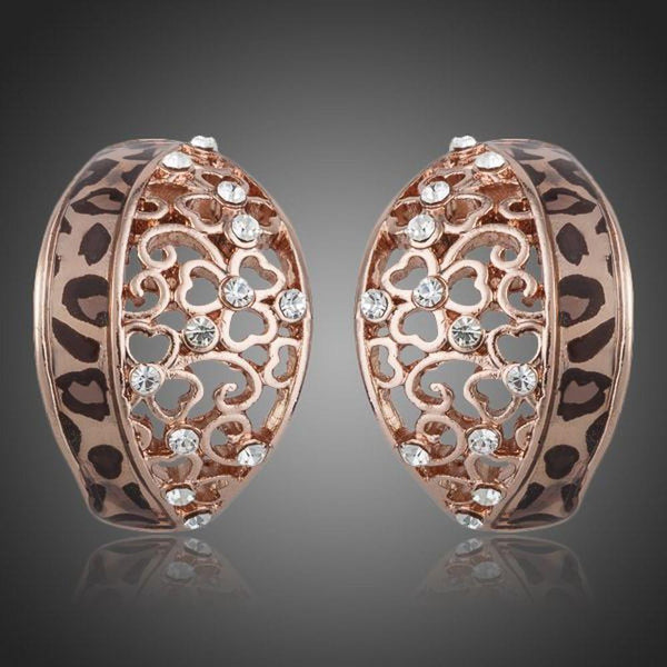 KHAISTA rose gold Stellux Austrian stud earrings on white background