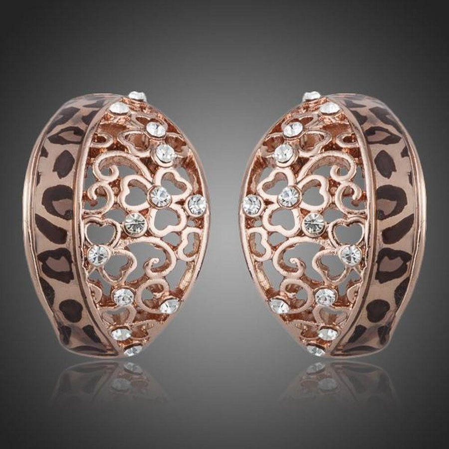 KHAISTA rose gold Stellux Austrian stud earrings on white background