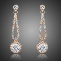 KHAISTA rose gold CZ drop earrings on white background