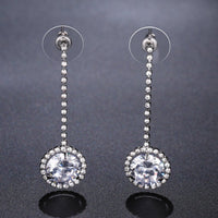 Close up of KHAISTA round AAA CZ drop earrings
