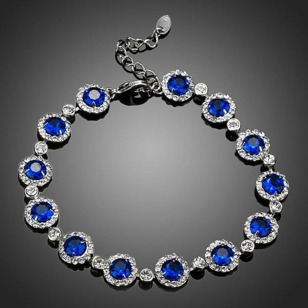 KHAISTA round blue CZ bracelet on white background