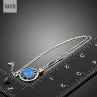 Pendant detail on KHAISTA round blue opal pendant necklace