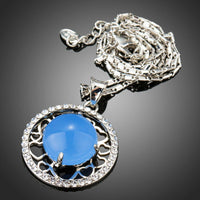 Close up detail of KHAISTA round blue opal pendant necklace