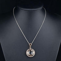 Close up detail of KHAISTA round circle crystal pendant necklace