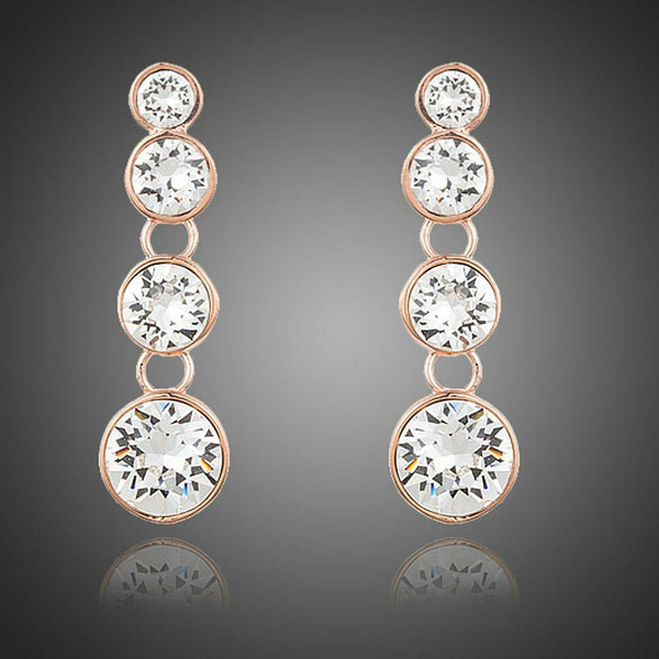 KHAISTA round crystal chain drop earrings on white background