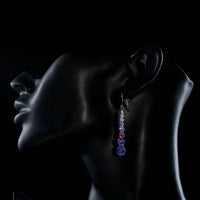 Side angle view of KHAISTA round crystal drop earrings