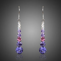 KHAISTA round crystal drop earrings on white background