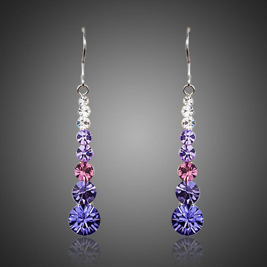 KHAISTA round crystal drop earrings on white background