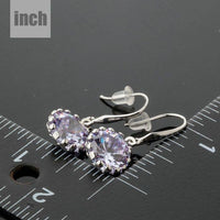 round CZ drop earrings detail view by KHAISTA