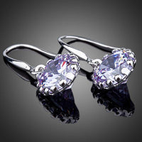 Close up of KHAISTA round CZ drop earrings
