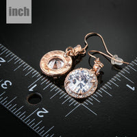 round CZ fashion drop earrings detail view by KHAISTA