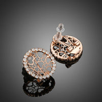 Close up of KHAISTA round CZ hearts clip earrings