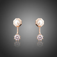 KHAISTA round CZ pearl stud earrings on white background