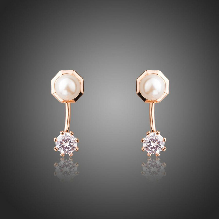 KHAISTA round CZ pearl stud earrings on white background