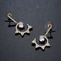 round crystal dangle earrings detail view by KHAISTA