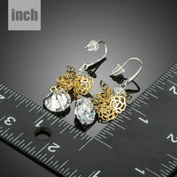round dangling CZ drop earrings detail view by KHAISTA