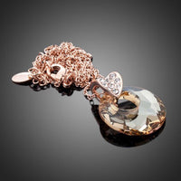 Close up detail of KHAISTA round link chain crystal necklace