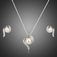 Khaista round pearl stud earrings necklace set on white background