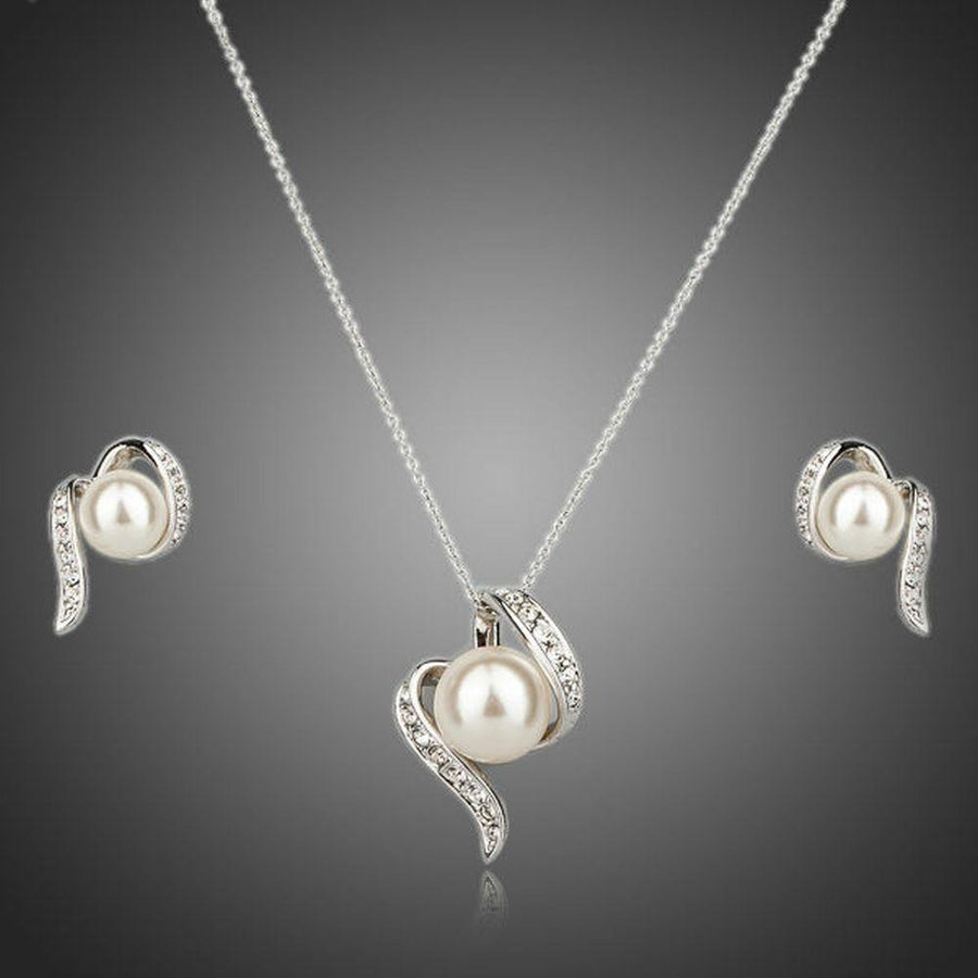 Khaista round pearl stud earrings necklace set on white background
