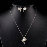 Side angle view of Khaista pearl stud set