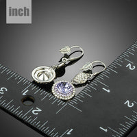 round purple CZ drop earrings detail view by KHAISTA