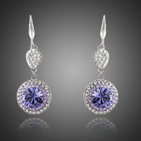 KHAISTA round purple CZ drop earrings on white background