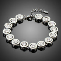 KHAISTA round rhinestone chain link bracelet on white background