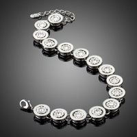 Close up detail of KHAISTA round rhinestone chain link bracelet